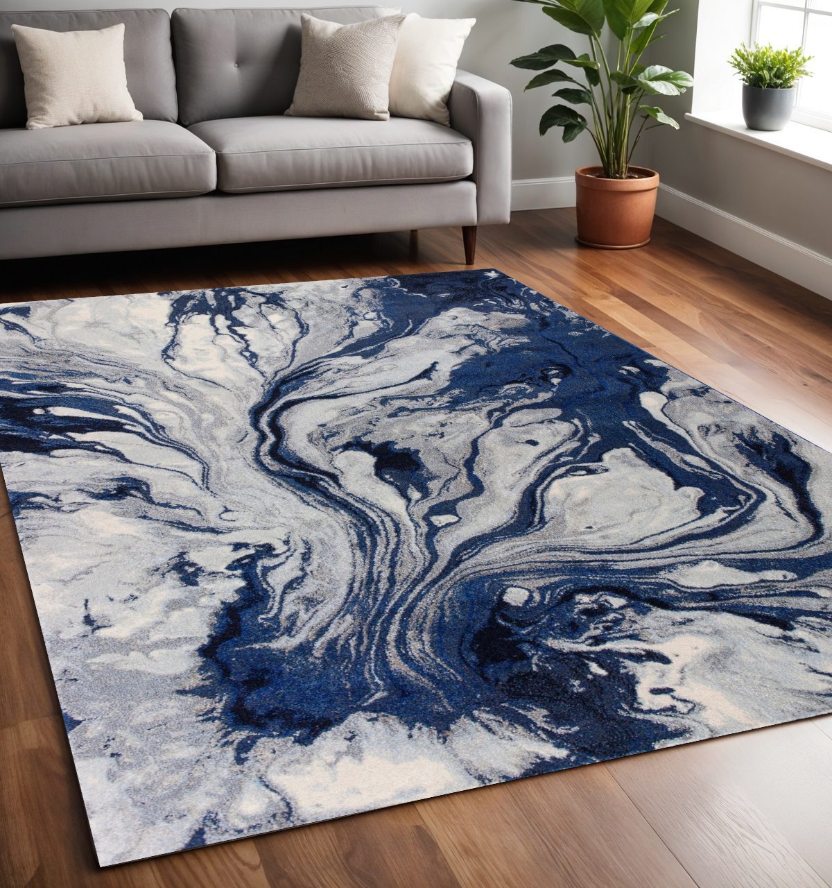 Blue Gray and Ivory Abstract Polypropylene Rectangle Area Rug, 5′ × 8′