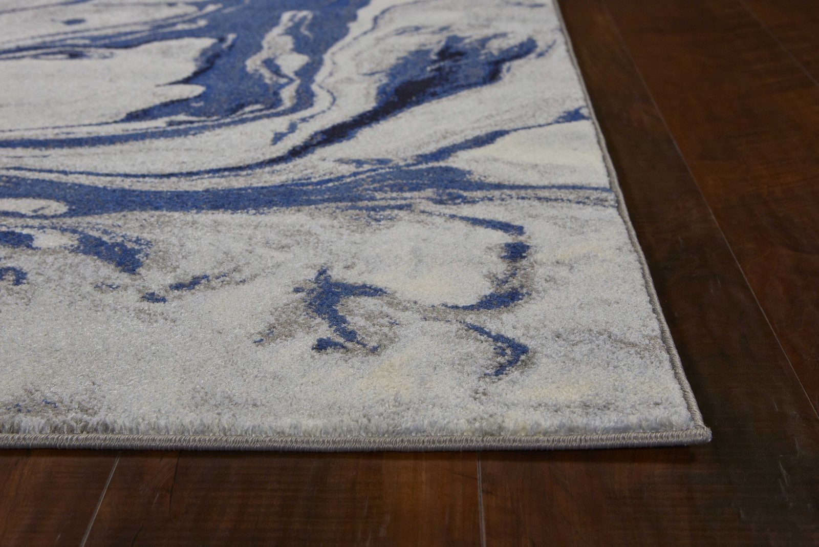 Blue Gray and Ivory Abstract Polypropylene Rectangle Area Rug
