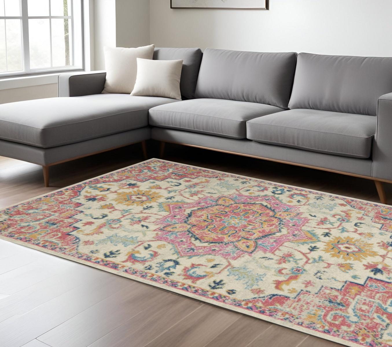 Pink and Ivory Southwestern Distressed Polypropylene Area Rug, 7′ × 10′