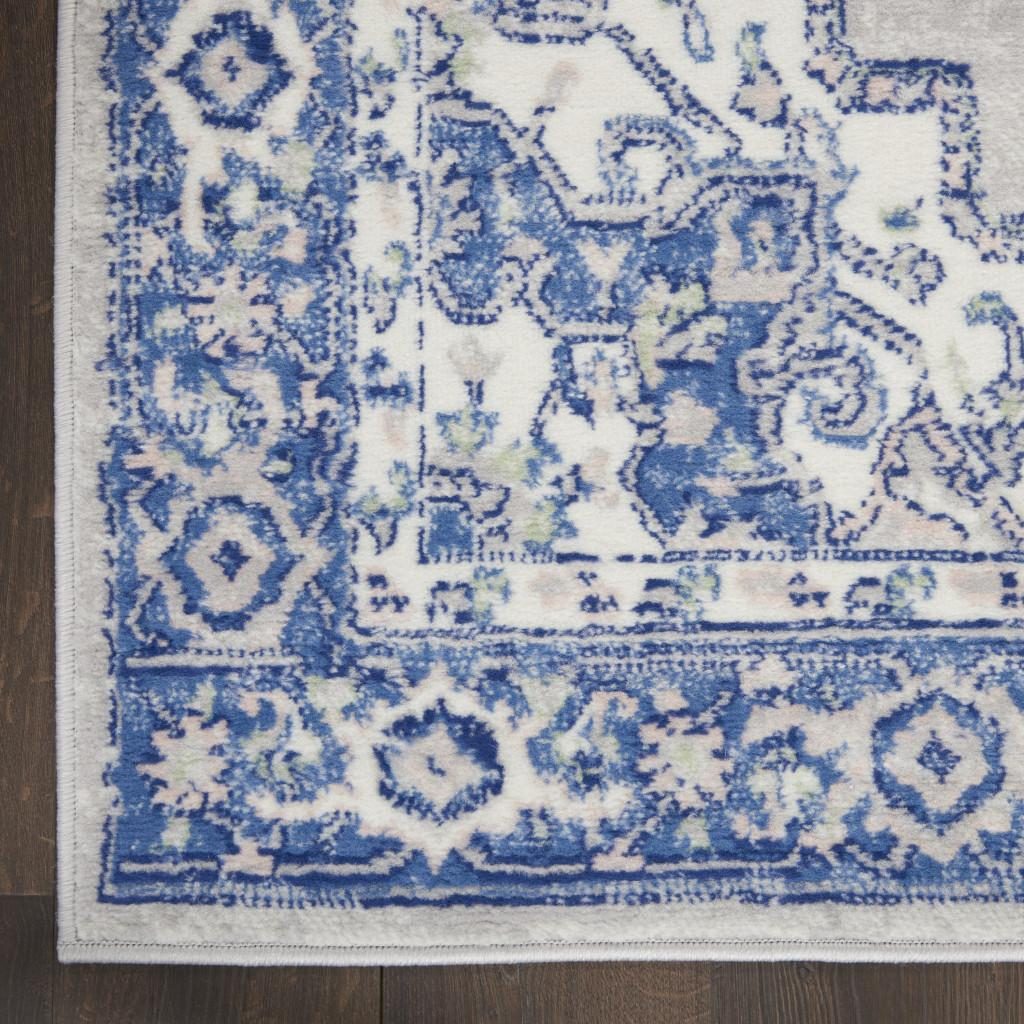 6′ X 9′ Blue and Gray Floral Polypropylene Area Rug