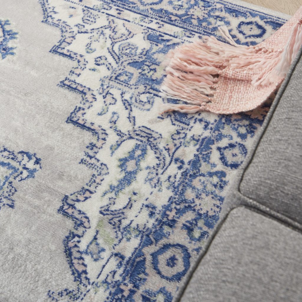 6′ X 9′ Blue and Gray Floral Polypropylene Area Rug
