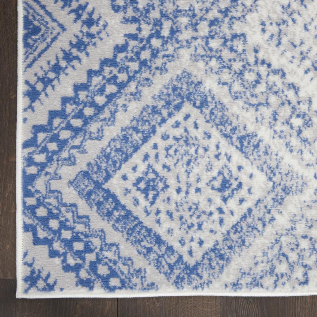 Ivory and Blue Geometric Polypropylene Area Rug