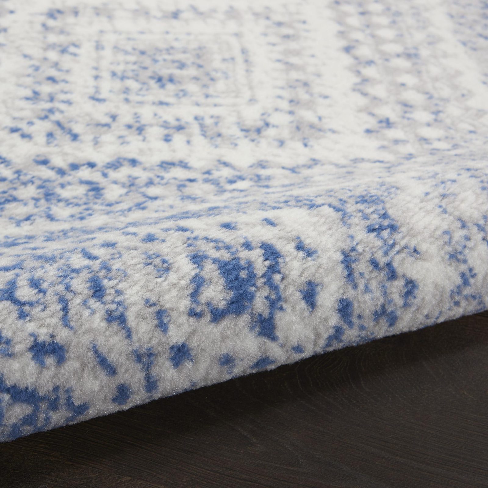 Ivory and Blue Geometric Polypropylene Area Rug