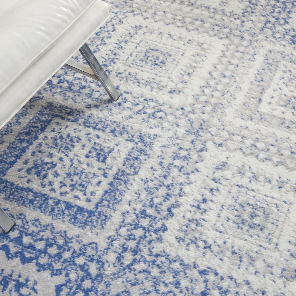 Ivory and Blue Geometric Polypropylene Area Rug