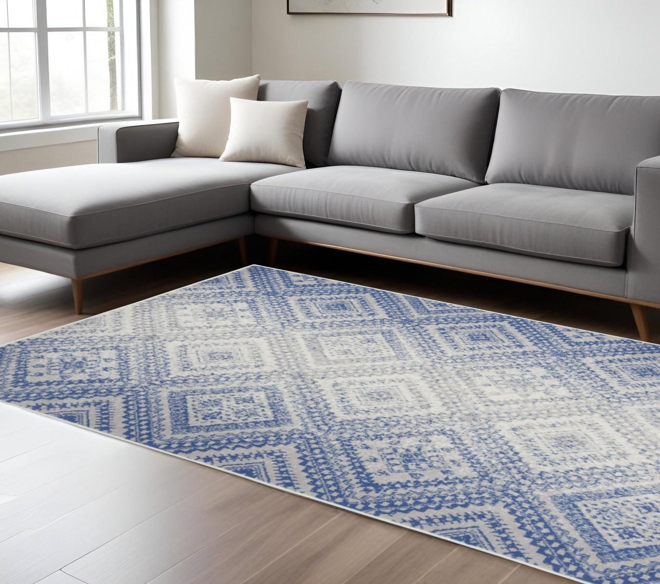 Ivory and Blue Geometric Polypropylene Area Rug, 6′ × 9′