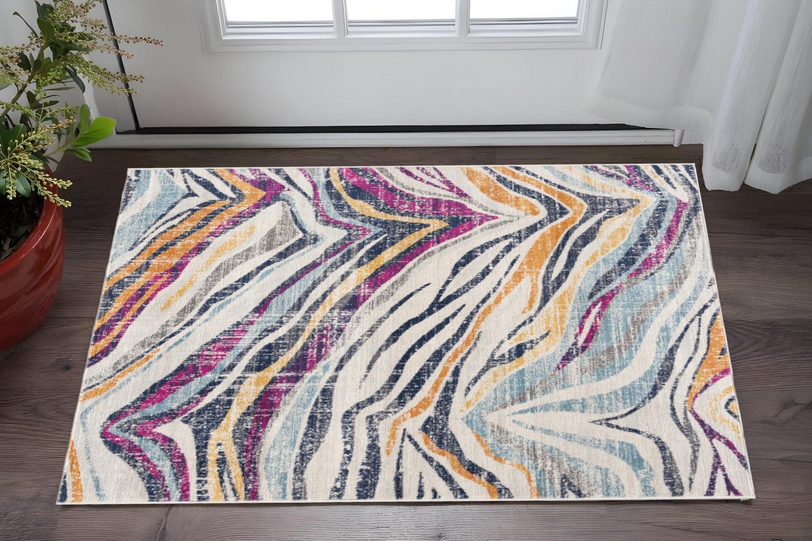 Blue and Gold Abstract Polypropylene Area Rug, 2′ × 5′