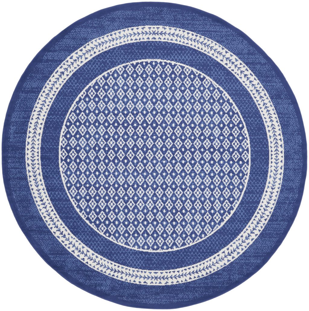 Ivory and Navy Blue Geometric Distressed Polypropylene Area Rug