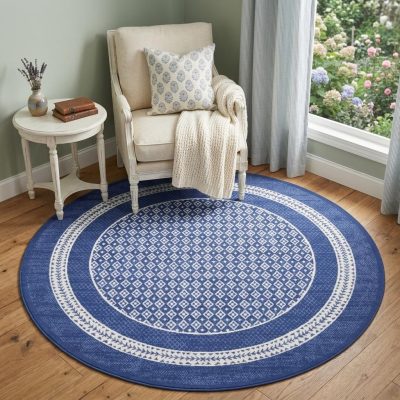 Ivory and Navy Blue Geometric Distressed Polypropylene Area Rug