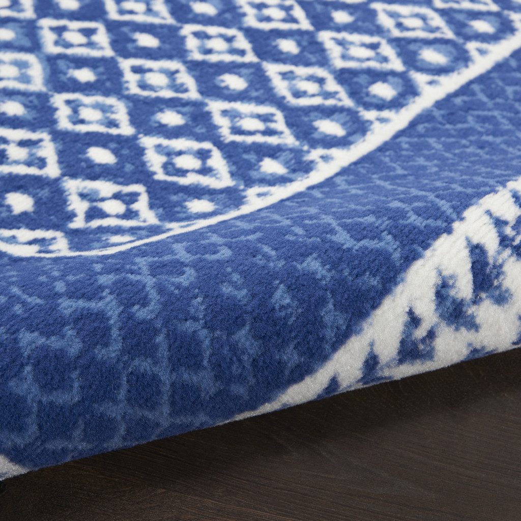 Ivory and Navy Blue Geometric Distressed Polypropylene Area Rug