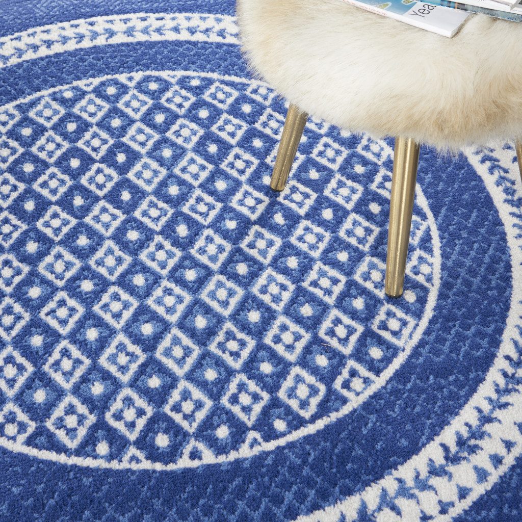 Ivory and Navy Blue Geometric Distressed Polypropylene Area Rug