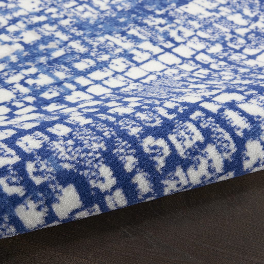 Ivory and Navy Blue Abstract Distressed Polypropylene Rectangle Area Rug
