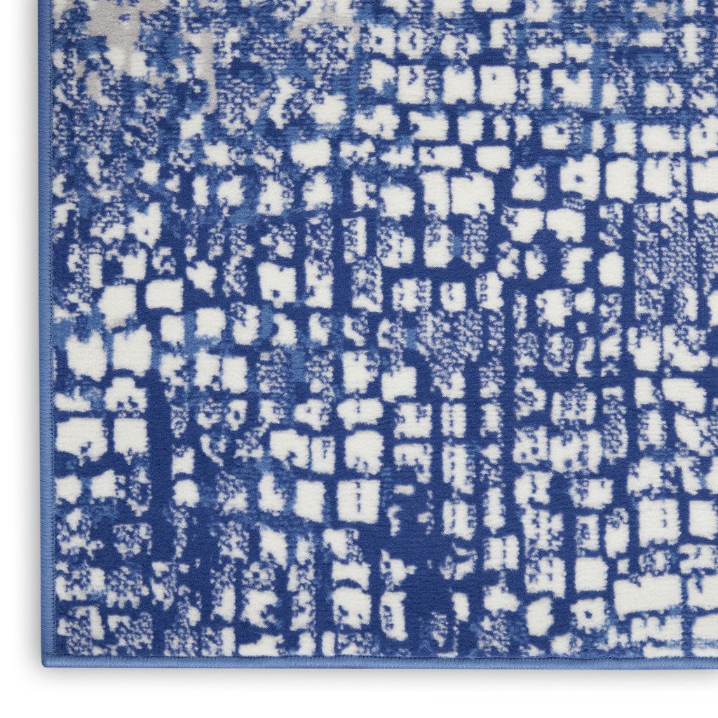 Ivory and Navy Blue Abstract Distressed Polypropylene Rectangle Area Rug