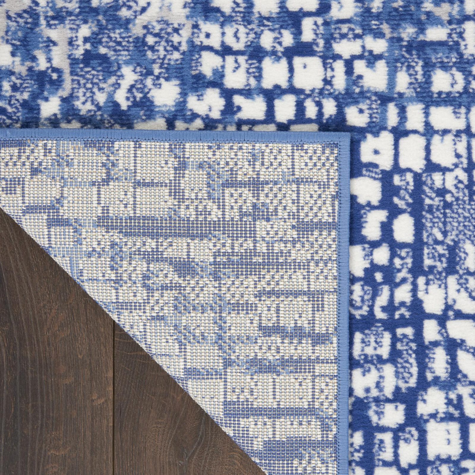 Ivory and Navy Blue Abstract Distressed Polypropylene Rectangle Area Rug