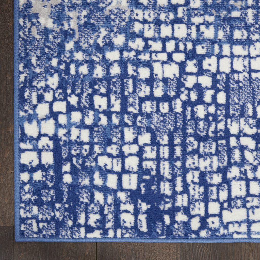Ivory and Navy Blue Abstract Distressed Polypropylene Rectangle Area Rug