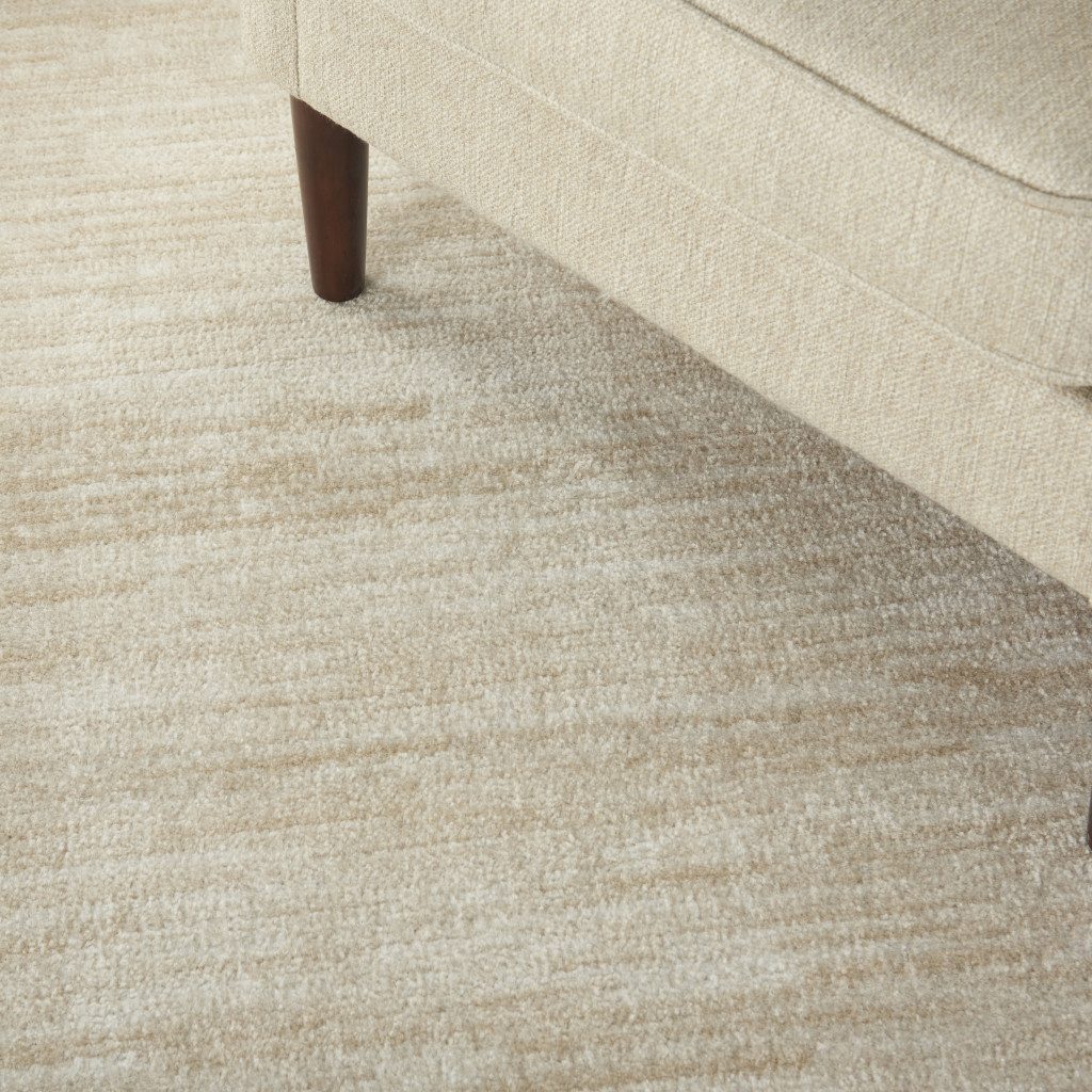 5′ X 7′ Beige and Ivory Indoor Outdoor Area Rug