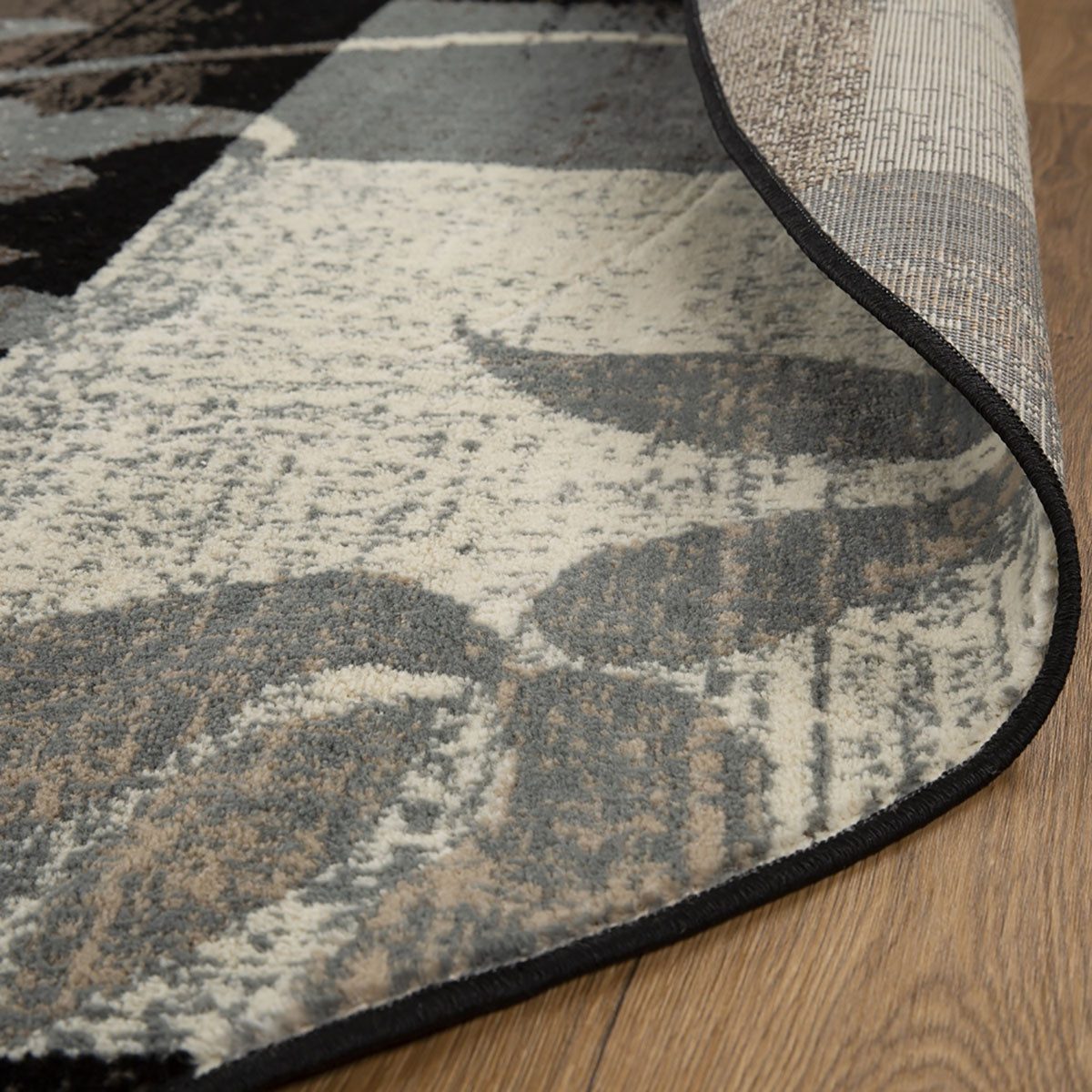 8′ Beige Brown and Gray Floral Distressed Round Rug