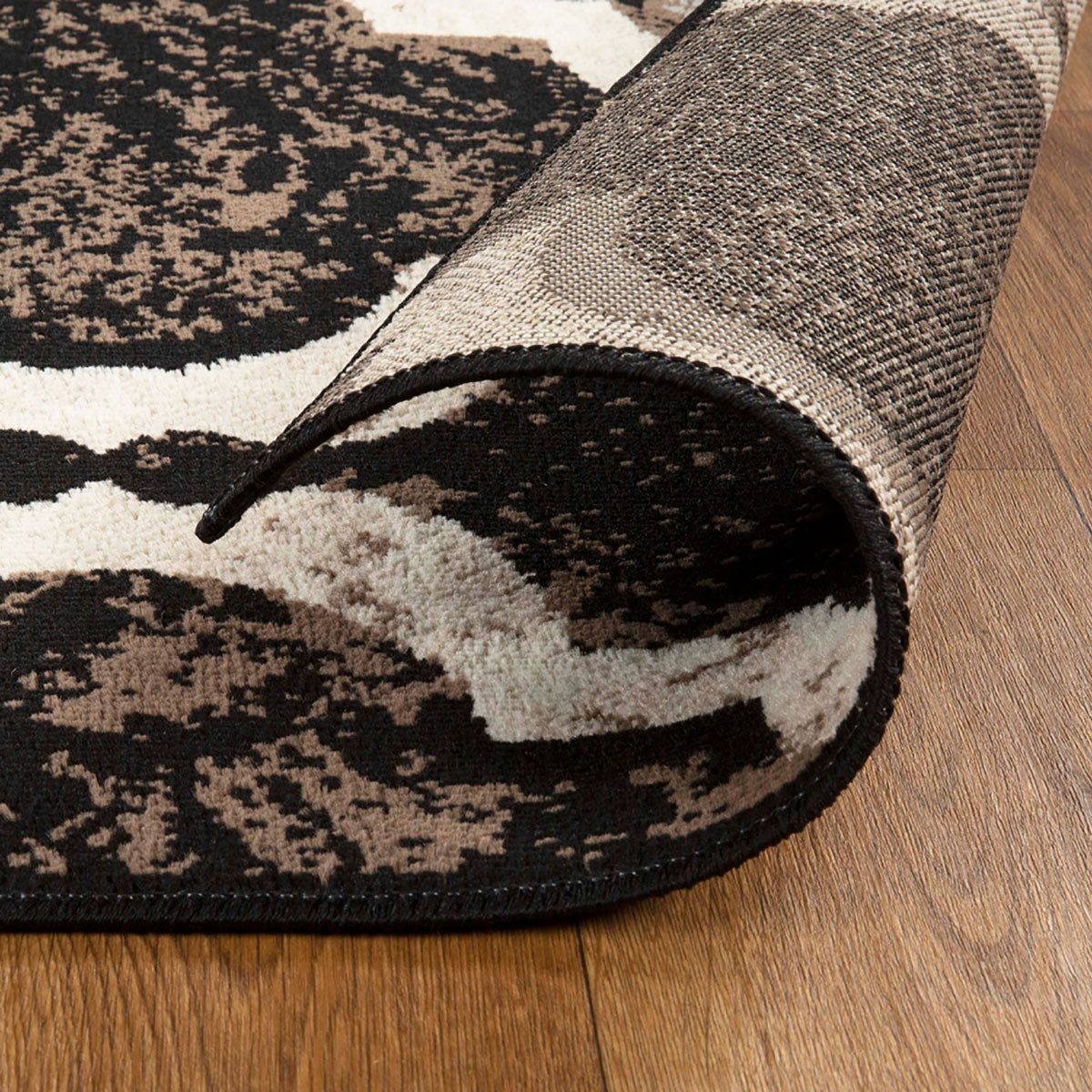 8′ Brown Black and Ivory Quatrefoil Distressed Runner Rug