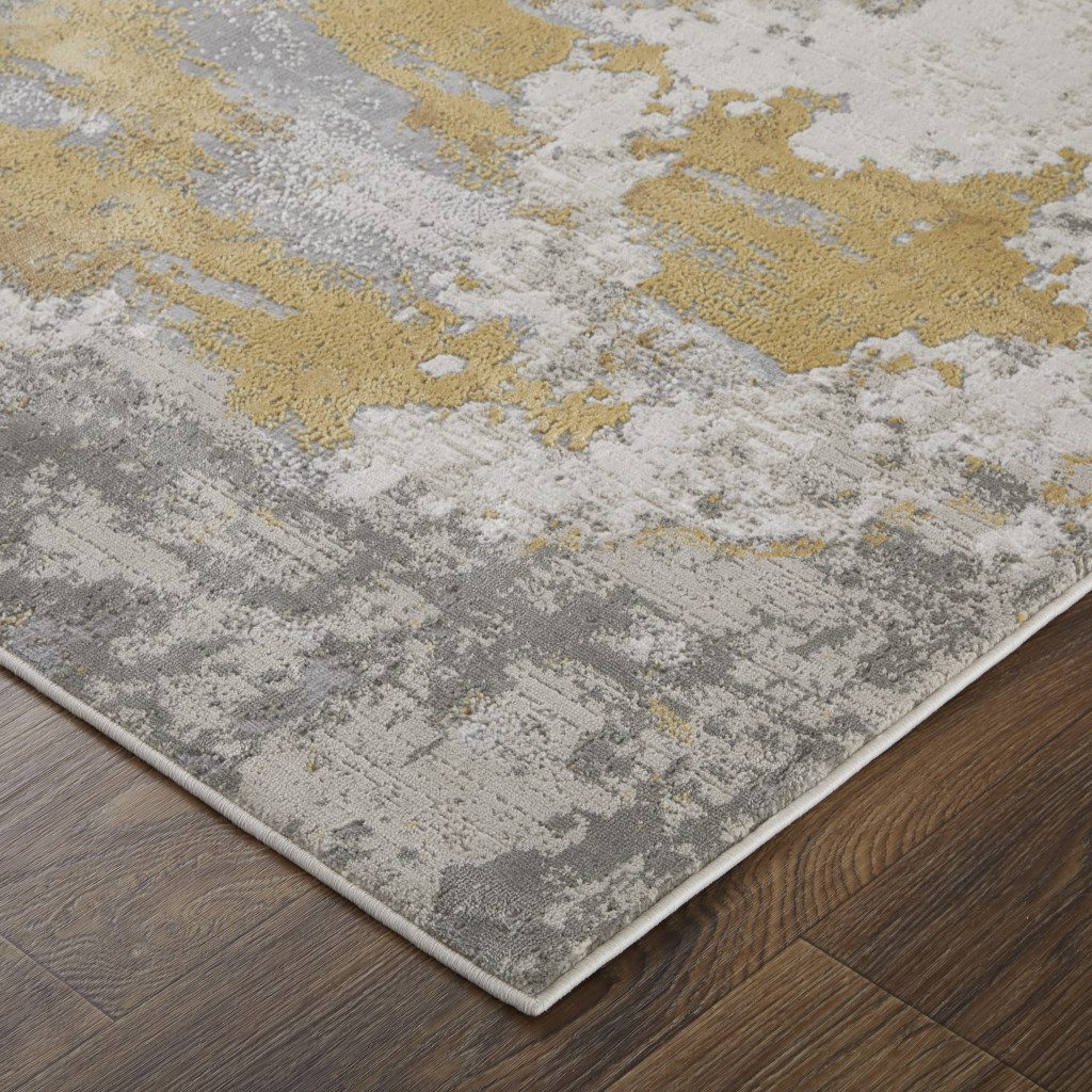 7′ X 10′ Ivory Gray And Gold Abstract Area Rug