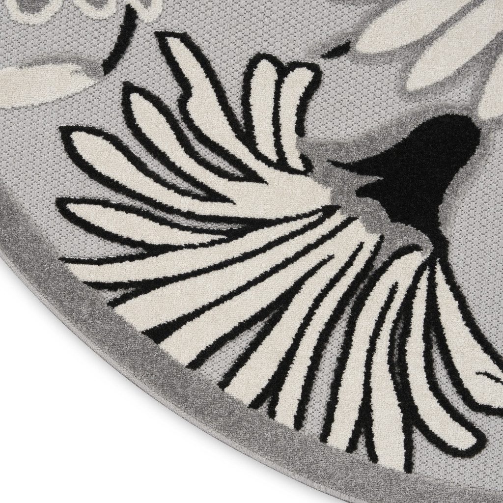 8′ Black and White Floral Indoor Outdoor Round Rug