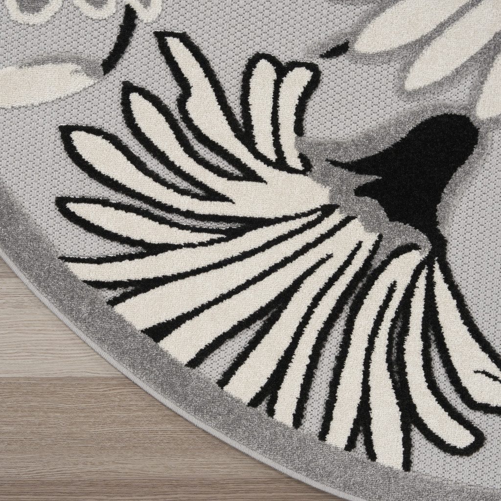 8′ Black and White Floral Indoor Outdoor Round Rug