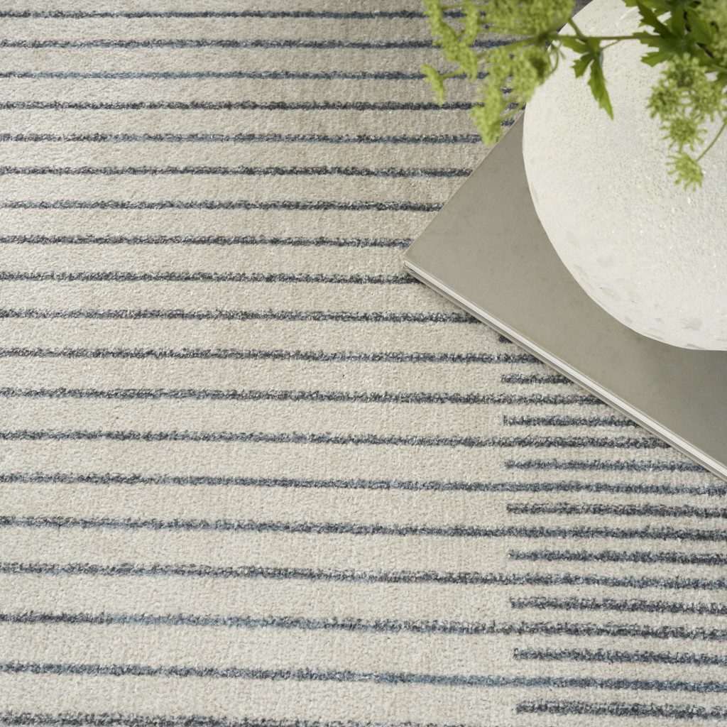 4′ X 6′ Blue and Ivory Geometric Washable Area Rug