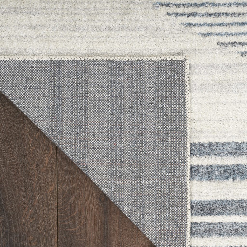 4′ X 6′ Blue and Ivory Geometric Washable Area Rug