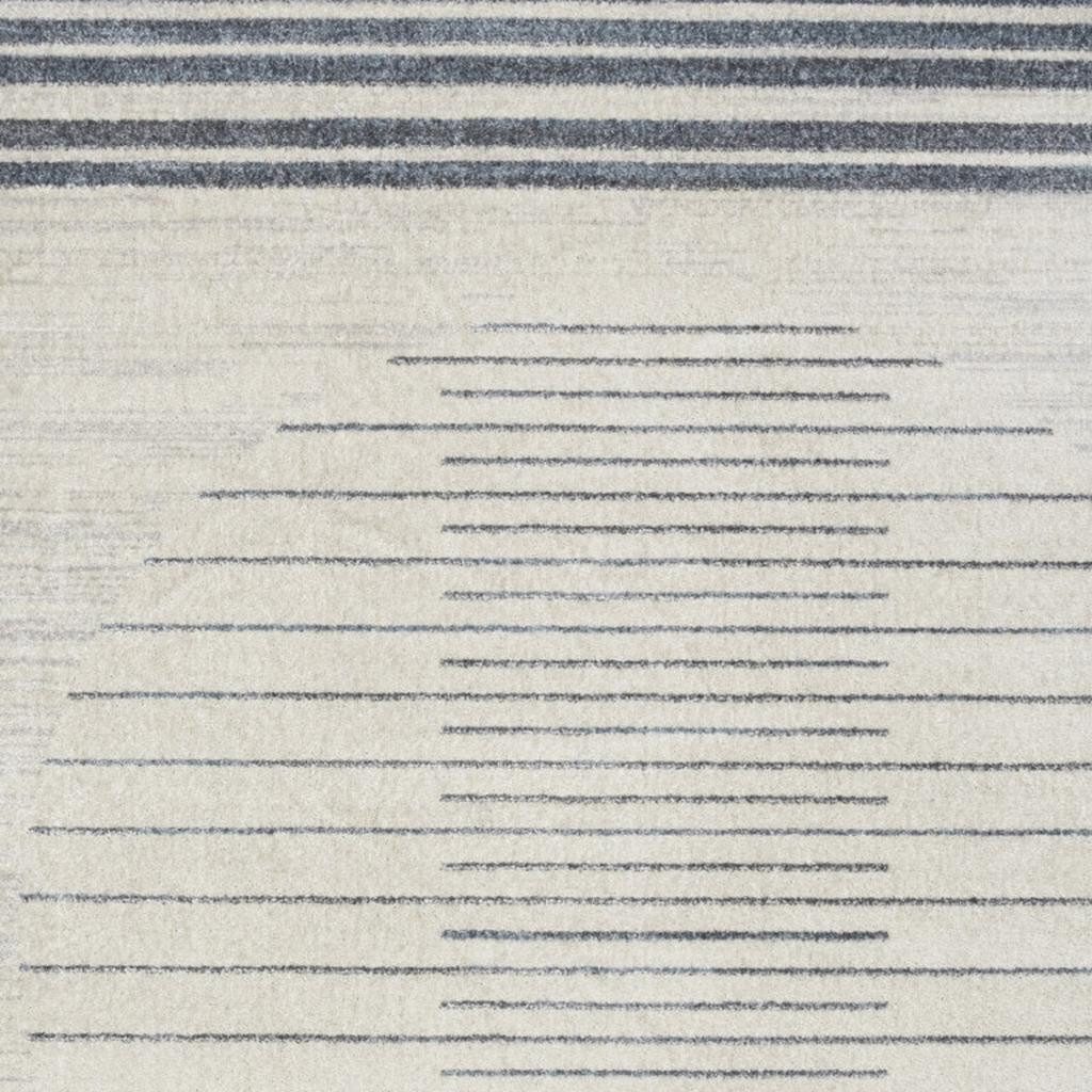 5′ X 7′ Blue and Ivory Geometric Washable Area Rug