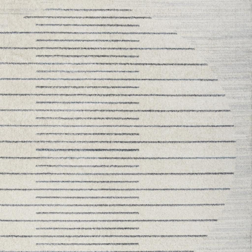 5′ X 7′ Blue and Ivory Geometric Washable Area Rug