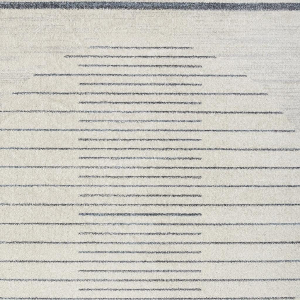 5′ X 7′ Blue and Ivory Geometric Washable Area Rug