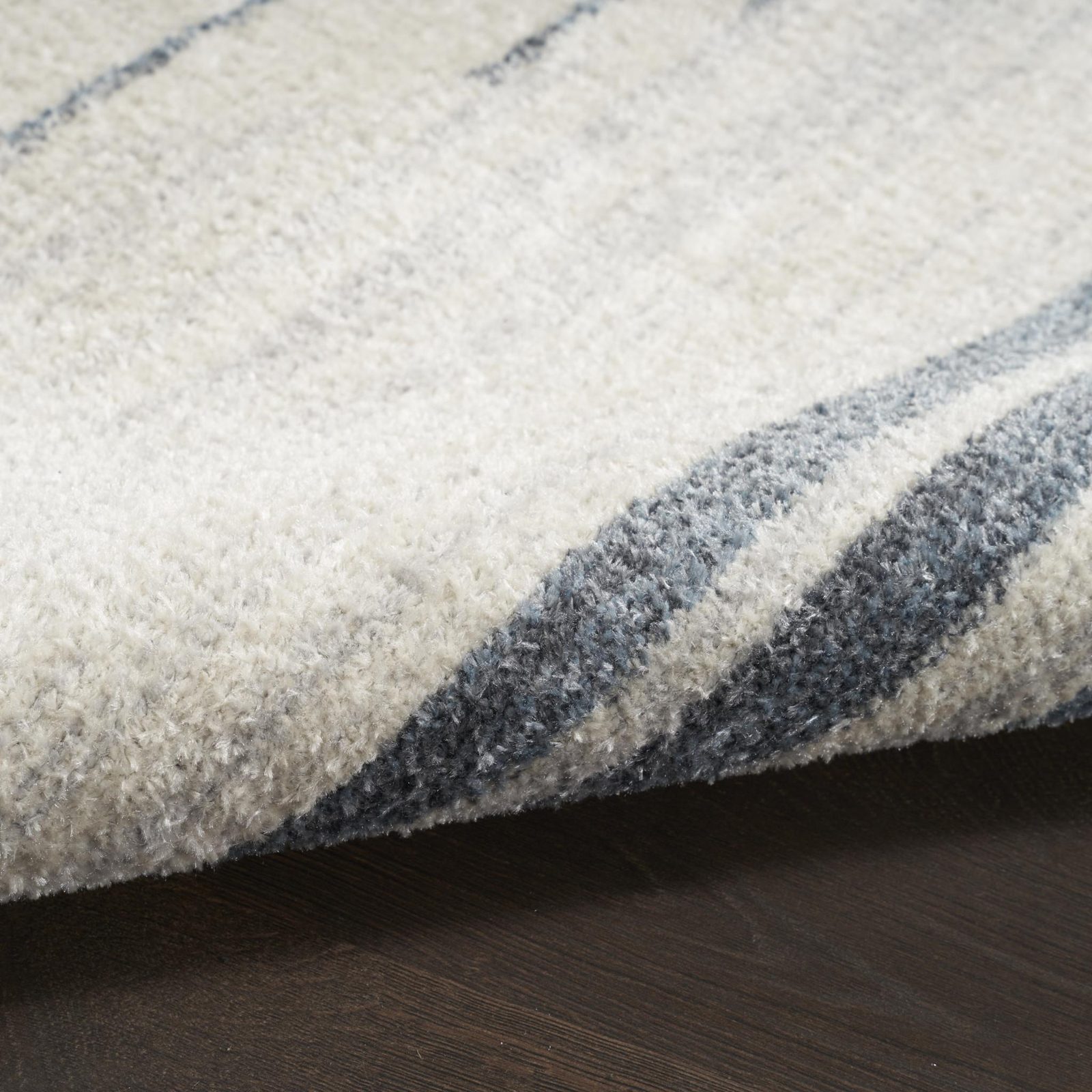5′ X 7′ Blue and Ivory Geometric Washable Area Rug