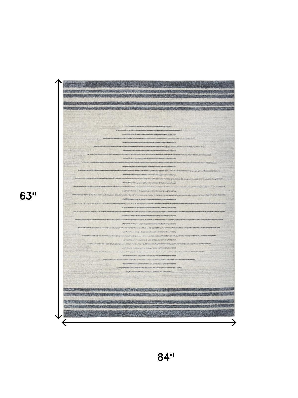 5′ X 7′ Blue and Ivory Geometric Washable Area Rug