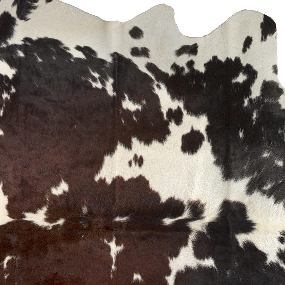 5′ X 7′ Brown and White Cowhide Area Rug IV