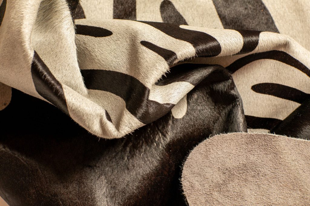 5′ X 7′ Black and Off White Cowhide Area Rug