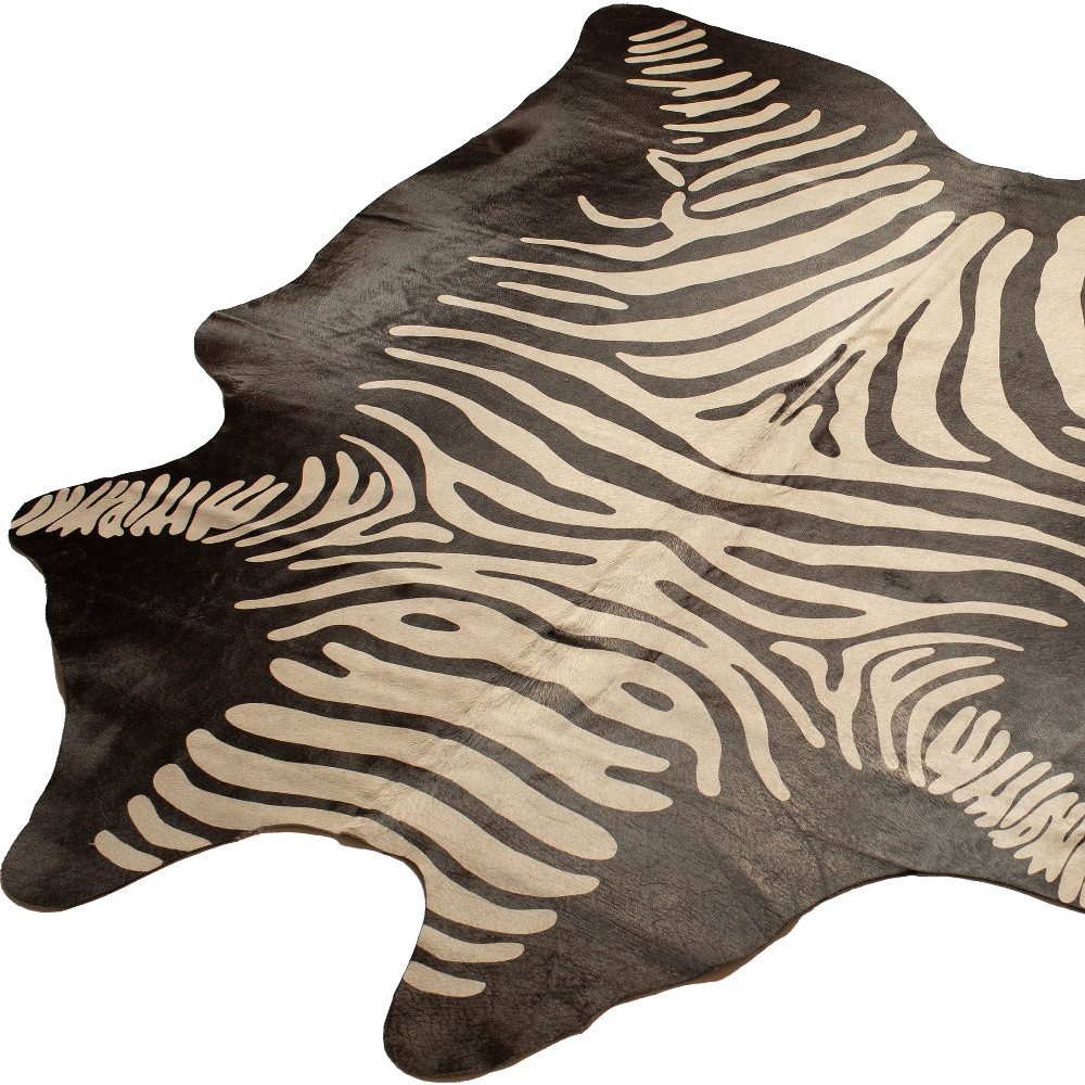 5′ X 7′ Black and Off White Cowhide Area Rug