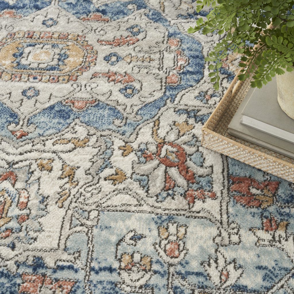 7′ X 10′ Blue and Ivory Distressed Medallion Area Rug