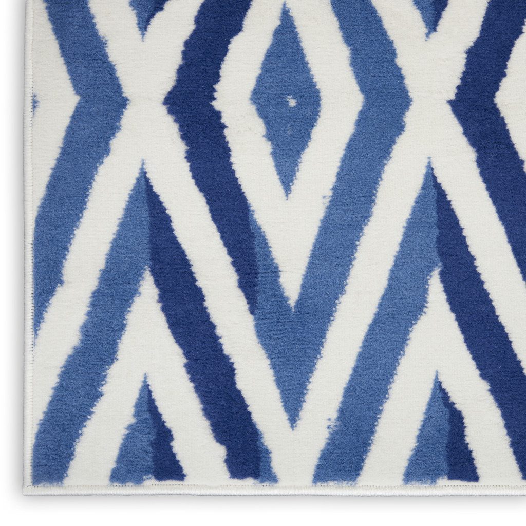 8′ X 10′ Ivory and Blue Geometric Distressed Area Rug