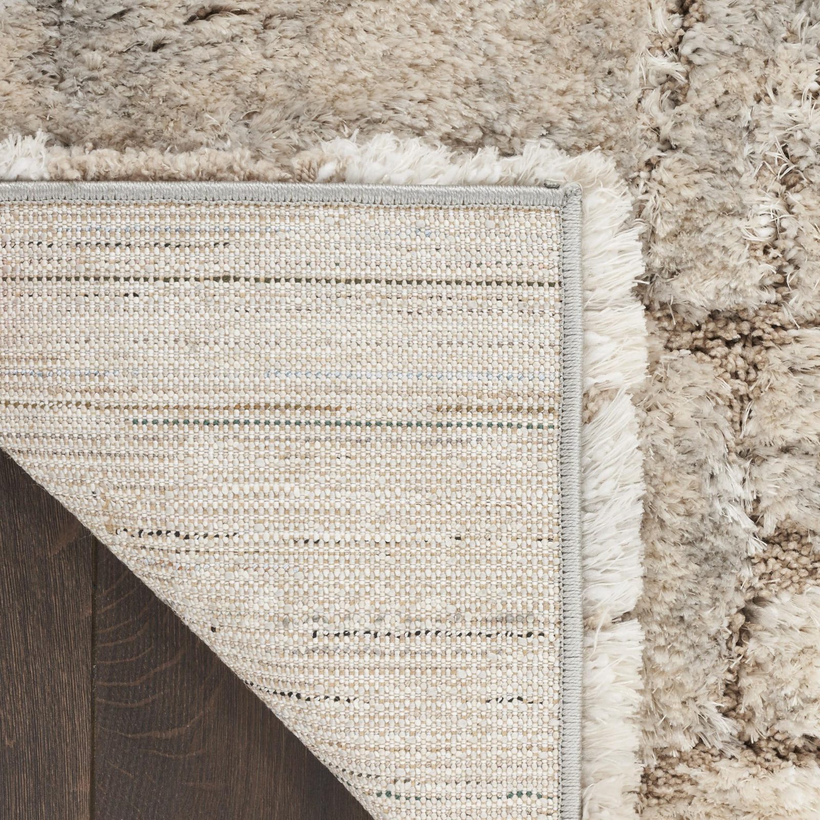 5′ X 7′ Beige and Ivory Abstract Shag Area Rug