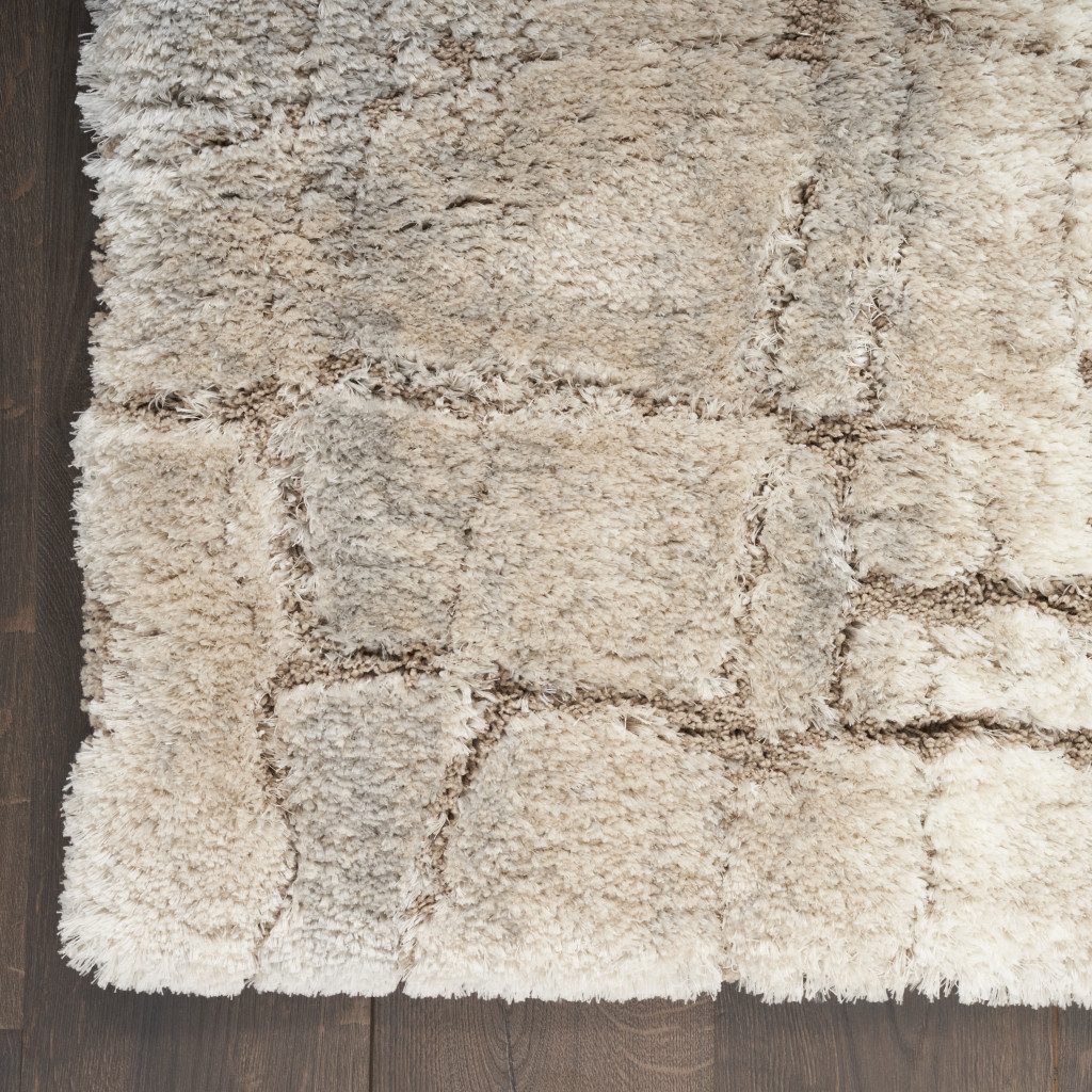 5′ X 7′ Beige and Ivory Abstract Shag Area Rug