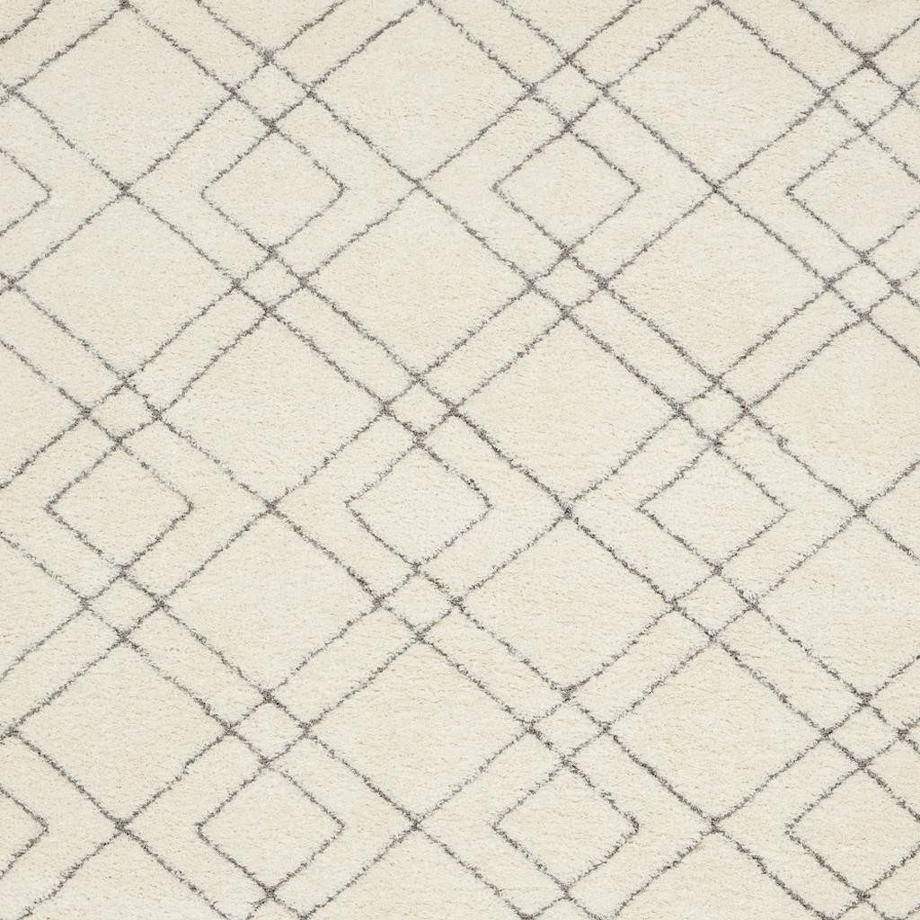 7′ X 9′ Ivory and Gray Geometric Shag Area Rug