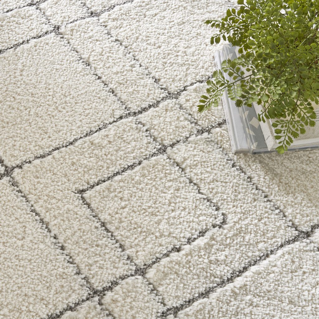 8′ X 10′ Ivory and Gray Geometric Shag Area Rug