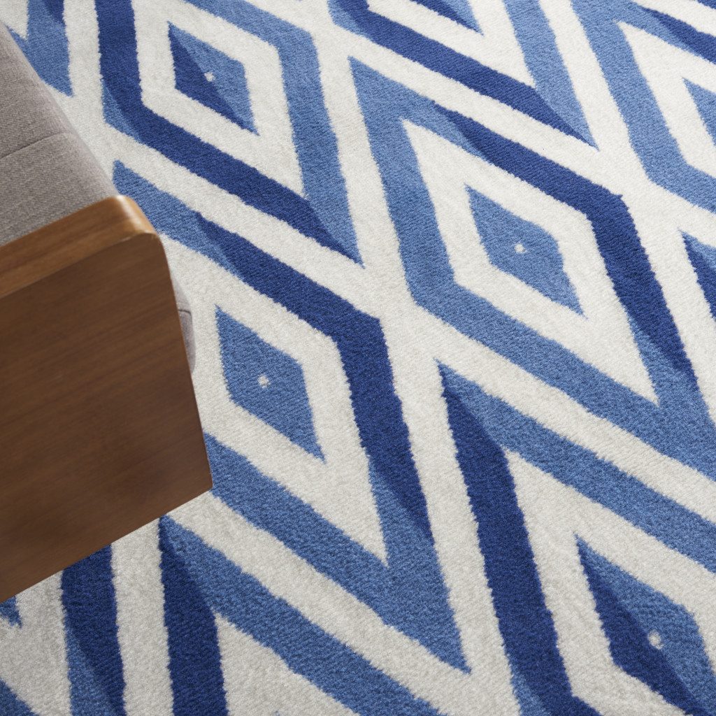 8′ X 12′ Ivory and Blue Geometric Distressed Area Rug