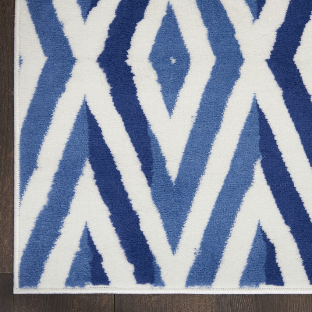8′ X 12′ Ivory and Blue Geometric Distressed Area Rug
