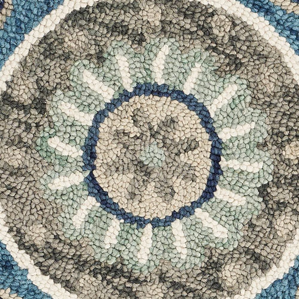 5′ Blue and Ivory Floral Hand Tufted Wool Round Rug
