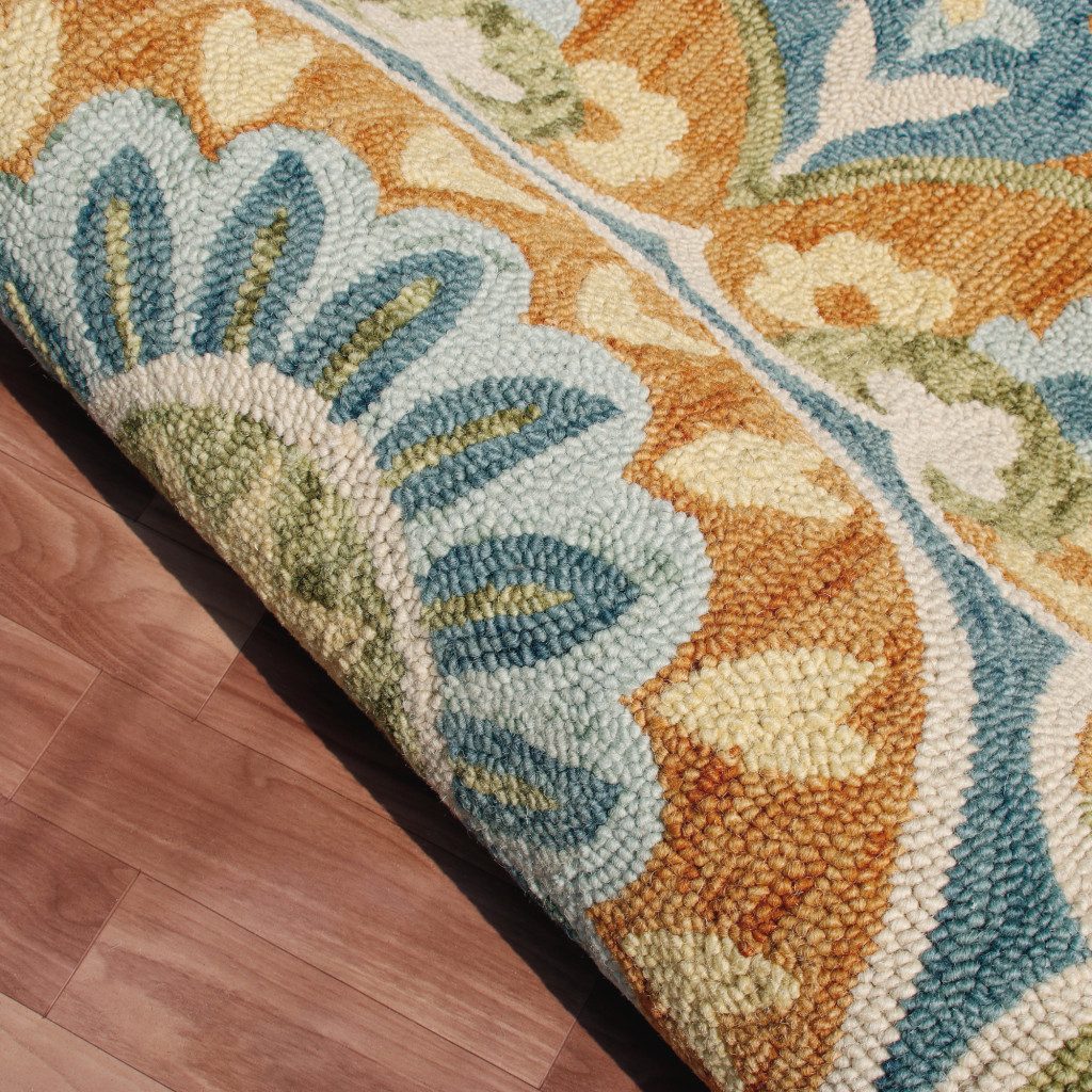 4′ Orange and Blue Round Wool Floral Hand Tufted Rug