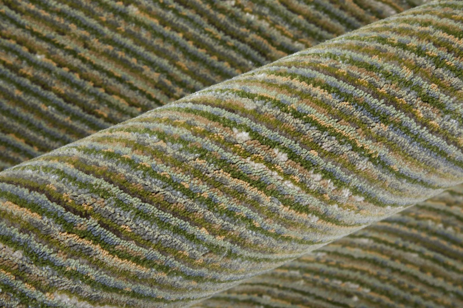 7′ X 10′ Tan and Green Power Loom Area Rug